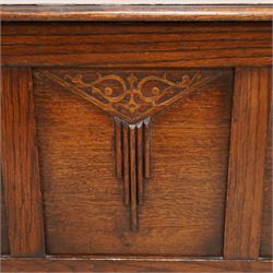 Early 20th century oak blanket chest, rectangular hinged top over triple panelled front with moulded decoration, on foliate carved ogee feet