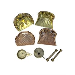 Four brass/copper crumb trays, pair of brass twist candlesticks, brass candle holder and a brass chamberstick