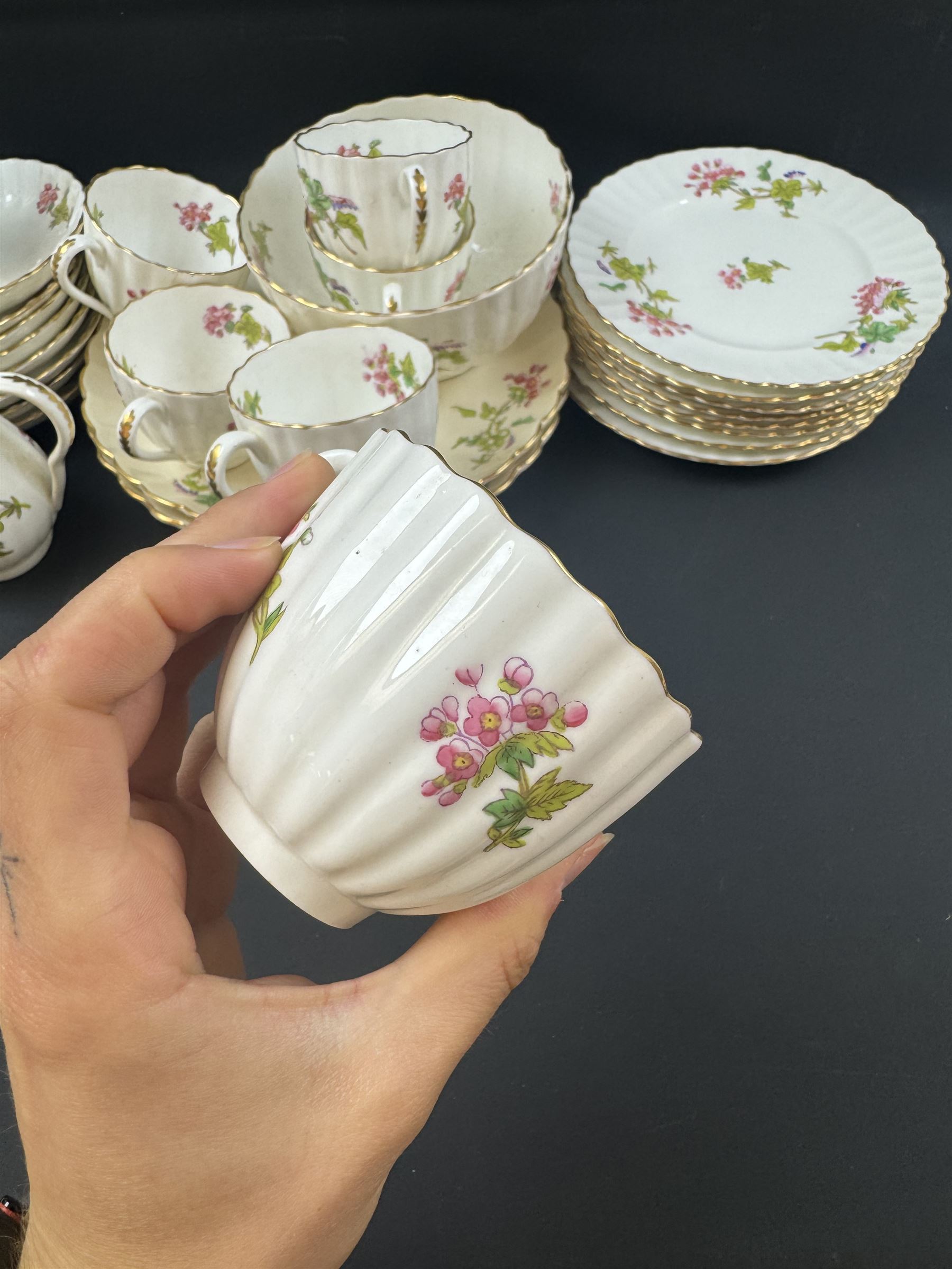 Coalport part tea service, decorated with floral sprigs, including eight cups and saucers, milk jug, eight dessert plates etc  