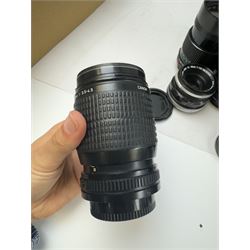 Seventeen Canon camera lenses, mostly FD examples, including 28-85mm 1:4 serial no, 49881, 35-105mm 1:3.5-4.5 serial no. 87632 and 135mm 1:2.8 serial no. 48336, one boxed