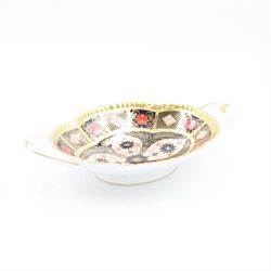 Royal Crown Derby Old Imari pattern 1128 twin handled sweetmeat dish, upon an oval pedestal, with printed mark beneath, H4.5cm, including handles W22.5cm 
