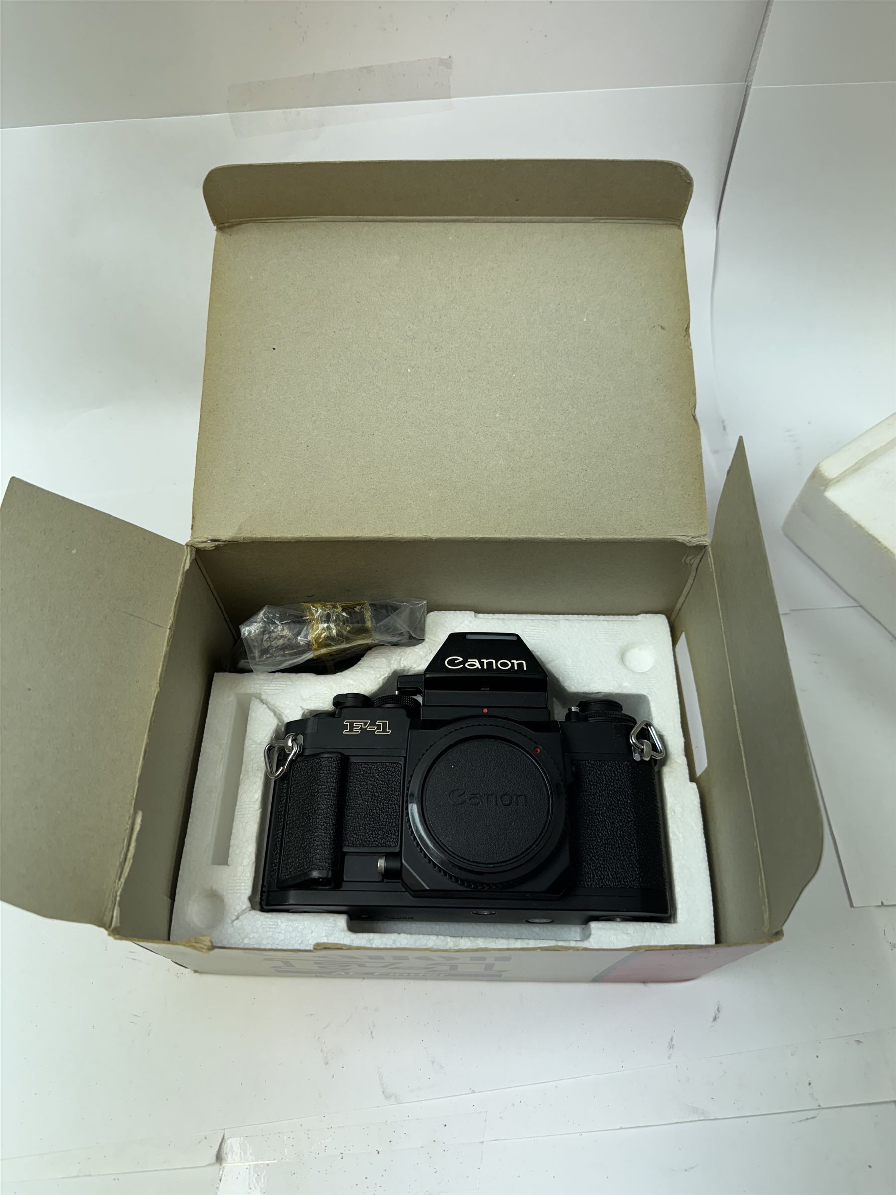 Canon F-1 SLR camera body serial no. 300461, boxed, together with thirteen Canon camera lenses, mostly FD, including 300mm 1:4 serial no. 18864, 100-300mm 1:5.6 serial no. 24187 and 200mm 1:2.8 serial no 16443, and three boxed FD extension tubes, some boxed