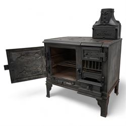 'The Holloway' cast iron portable range stove, fitted with surface burners and oven, on angular bracket feet 