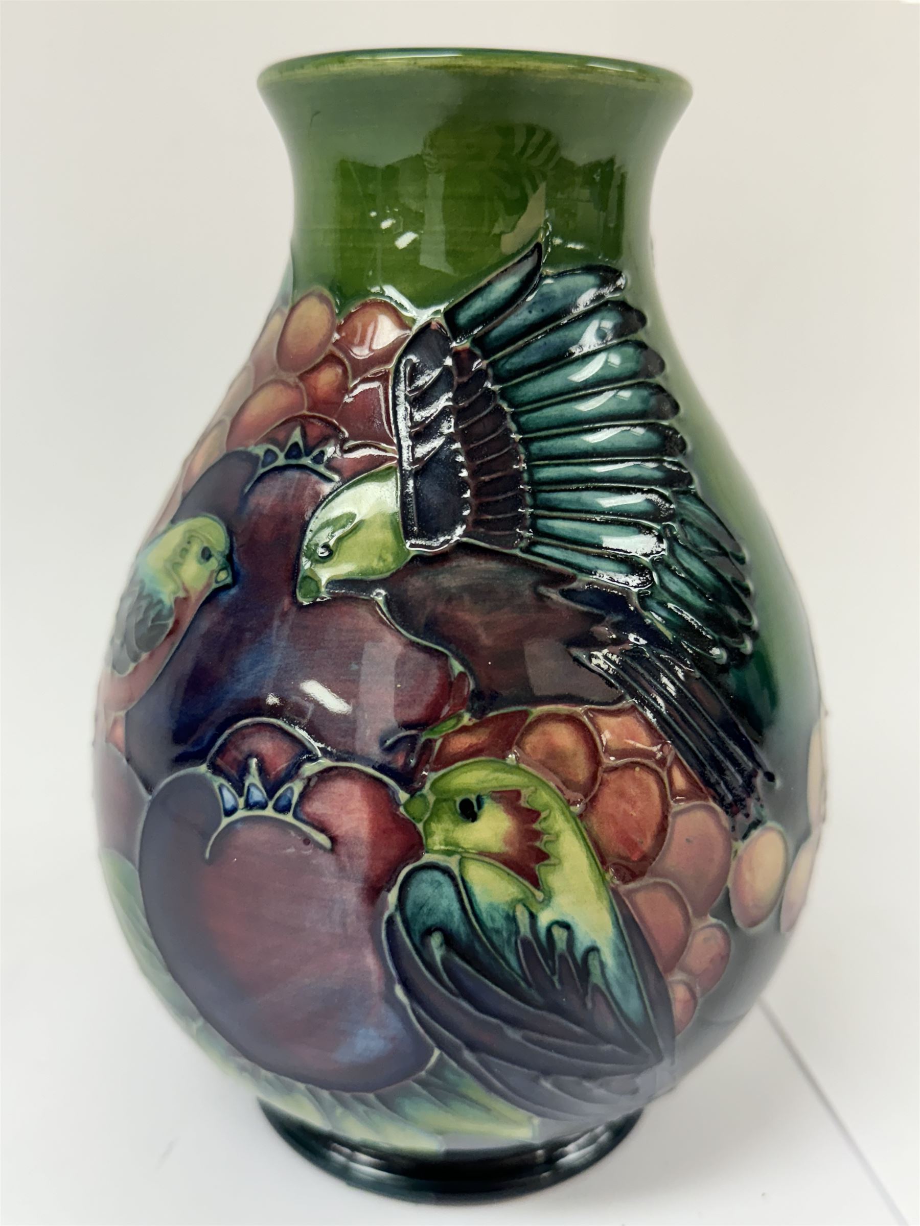 Moorcroft vase of baluster decorated in the Finches pattern with green ground, designed by Sally Tuffin, with makers mark beneath, H20cm