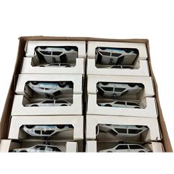 Twenty four white tin plate cars, in boxes 