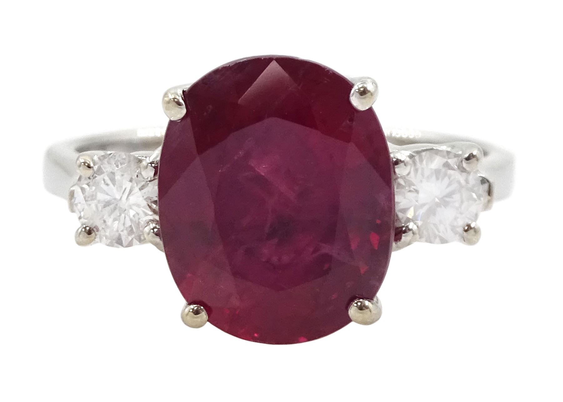 18ct white gold three stone oval cut ruby and round brilliant cut diamond ring, hallmarked, ruby approx 4.30 carat