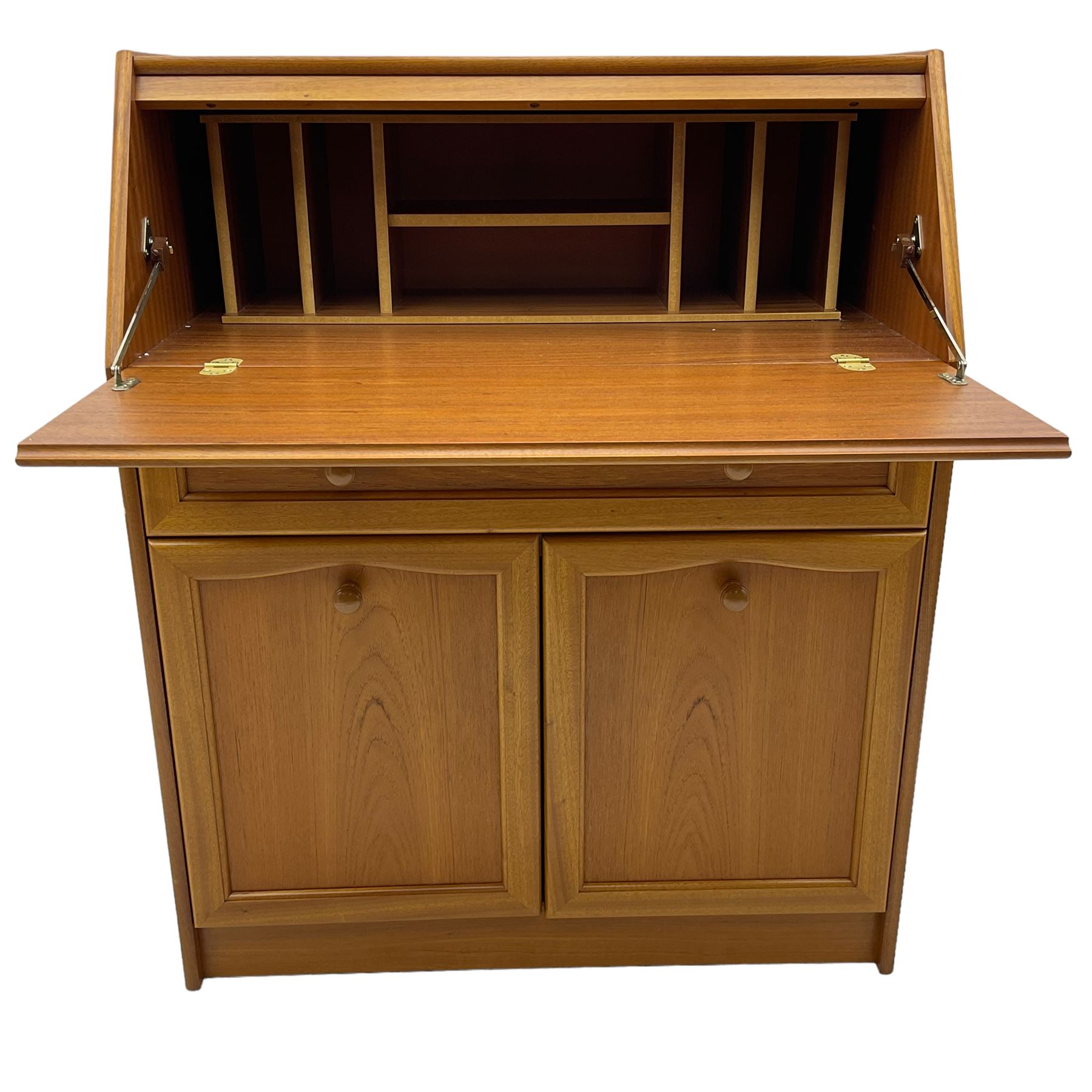 Mid 20th century teak bureau, sloped fall-front opening to reveal fitted interior with compartments, over panelled full width drawer and two cupboard doors, on recessed plinth base