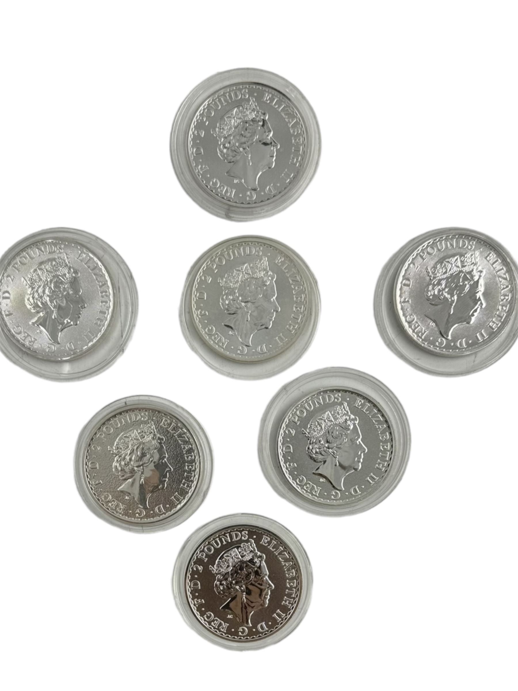 Seven Queen Elizabeth II one ounce fine silver Britannia two pound coins, including 2017, 2018, 2019 etc