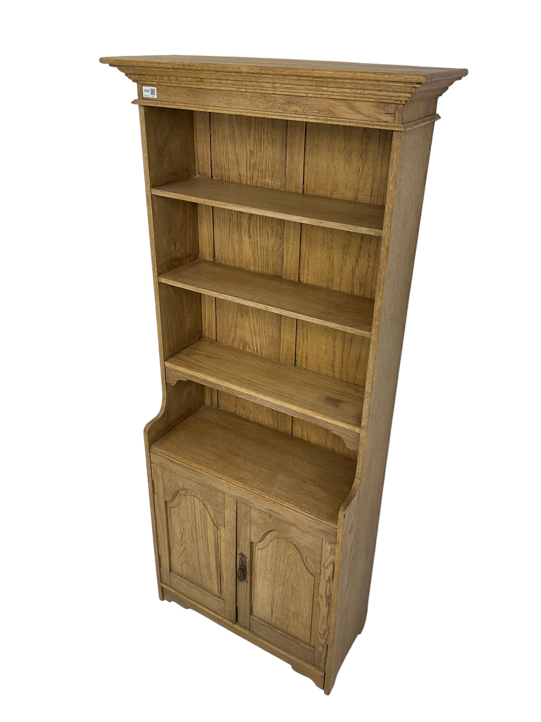 Contemporary light oak open bookcase, fitted with three shelves over double cupboard