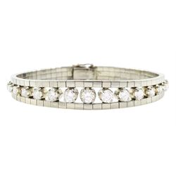 18ct white gold diamond bracelet, seventeen graduating round brilliant cut diamonds, to a ...