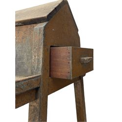 19th century teak saddle horse, A-frame on trestle base, fitted with shelves at either side and end drawers, on square supports united by undertier 