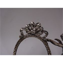 Edwardian silver double photograph frame by Berthold Herrman Muller, the oval frames each with ribbon surmount and supported by a central cherub, H8.5cm