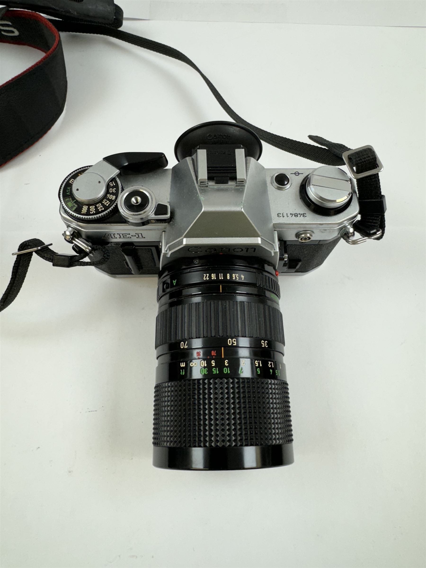 Canon AE-1 camera body, serial no. 3484113, with a Canon Zoom Lens FD 35-70mm 1:4, serial no. 103833, together with a Canon EOS 30D camera body, serial no. 1230810818, with a   Canon Zoom Lens EF-S 18-55mm 1:3.5-5.6 II, serial no. 2140596539, in Tuf Foto Pro carry case, with accessories 