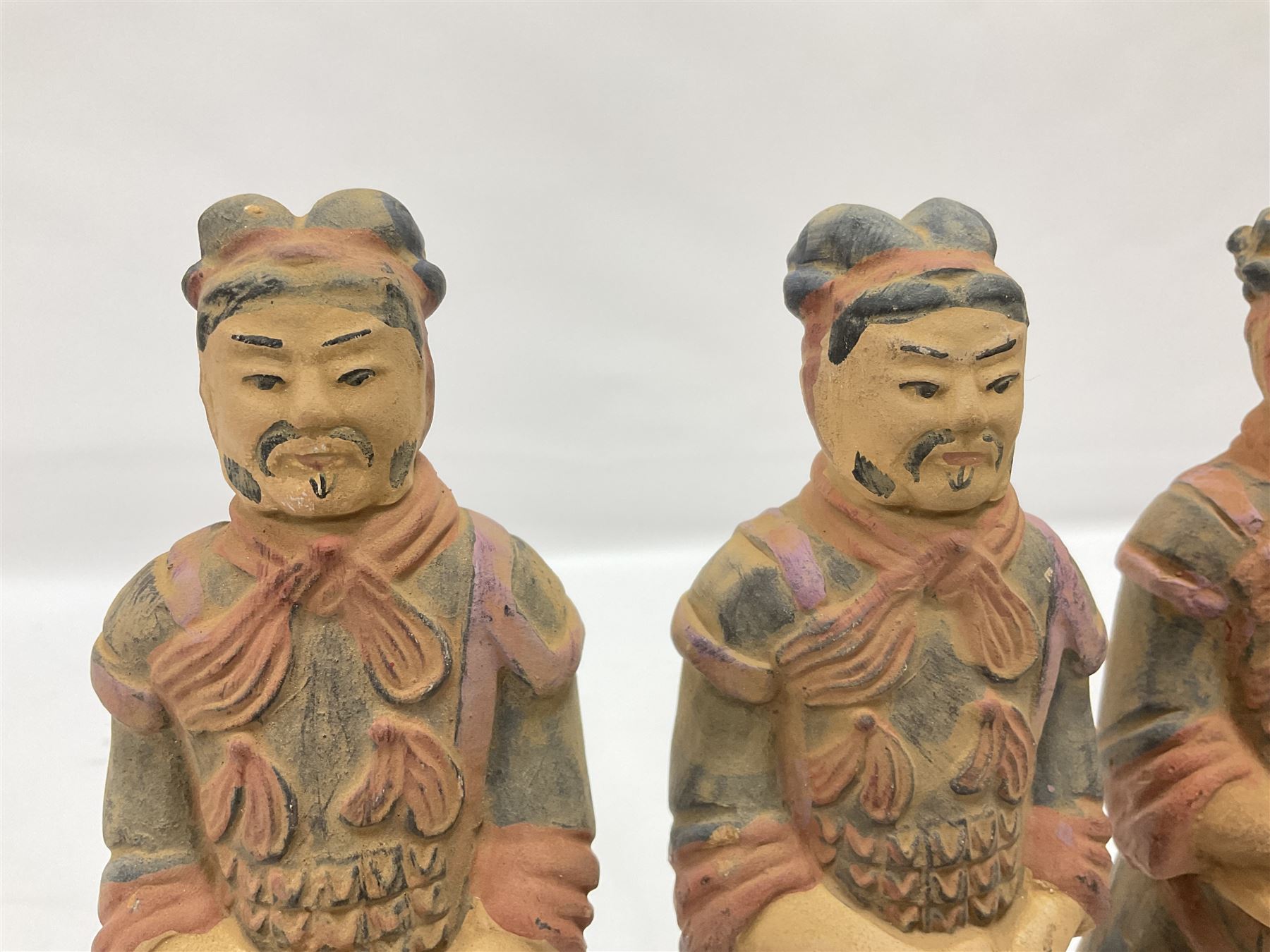 Set of three painted Chinese 'Terracotta Warrior' style figures, H20cm