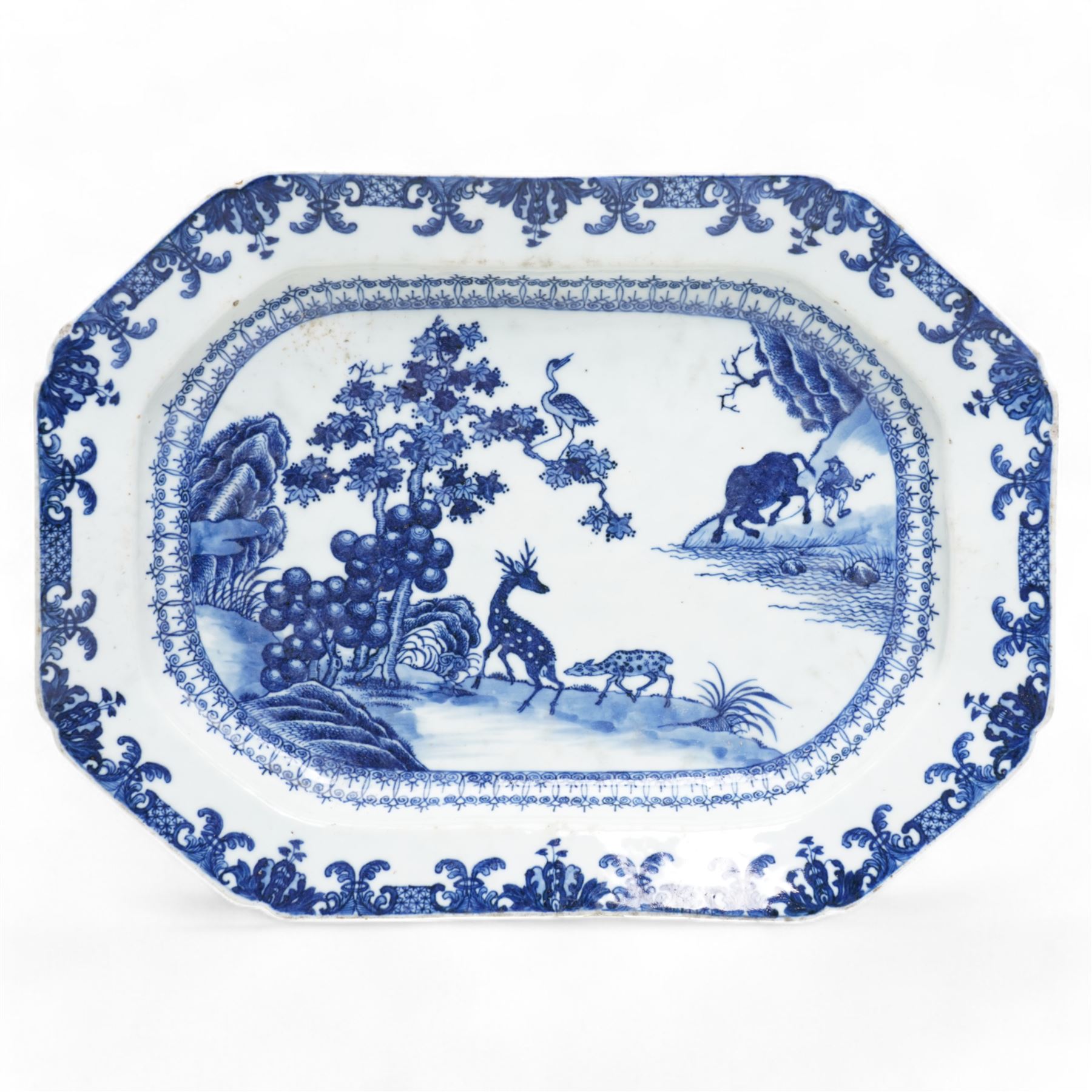 18th century, Qianlong period, Chinese Export blue and white octagonal serving platter, decorated with a figure with a buffalo, two deer and a crane by a river bank, amid foliage and rockwork, within a lambrequin border, L38cm x W28cm 