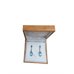 Pair of silver, marcasite and blue topaz pendant earrings, boxed 