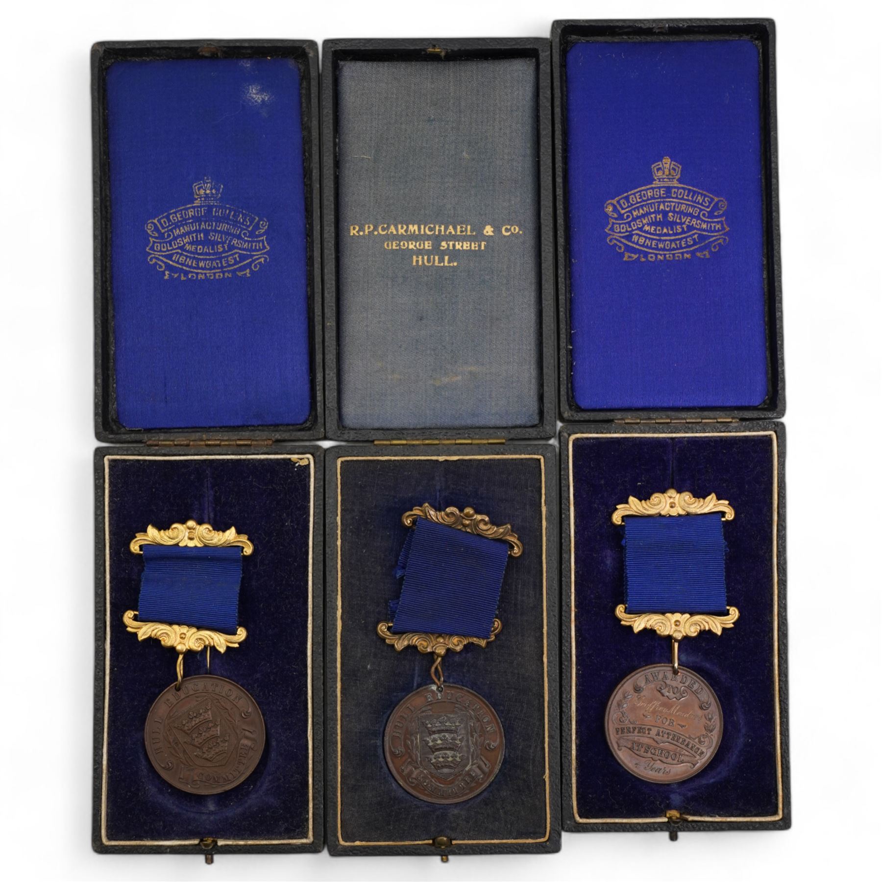 Eighteen Hull Education Committee 'Perfect Attendance At School' medallions, six cased and three Hull Times Long Service Medals 'For 25 Years Continuous Service', housed in a Lindner tray