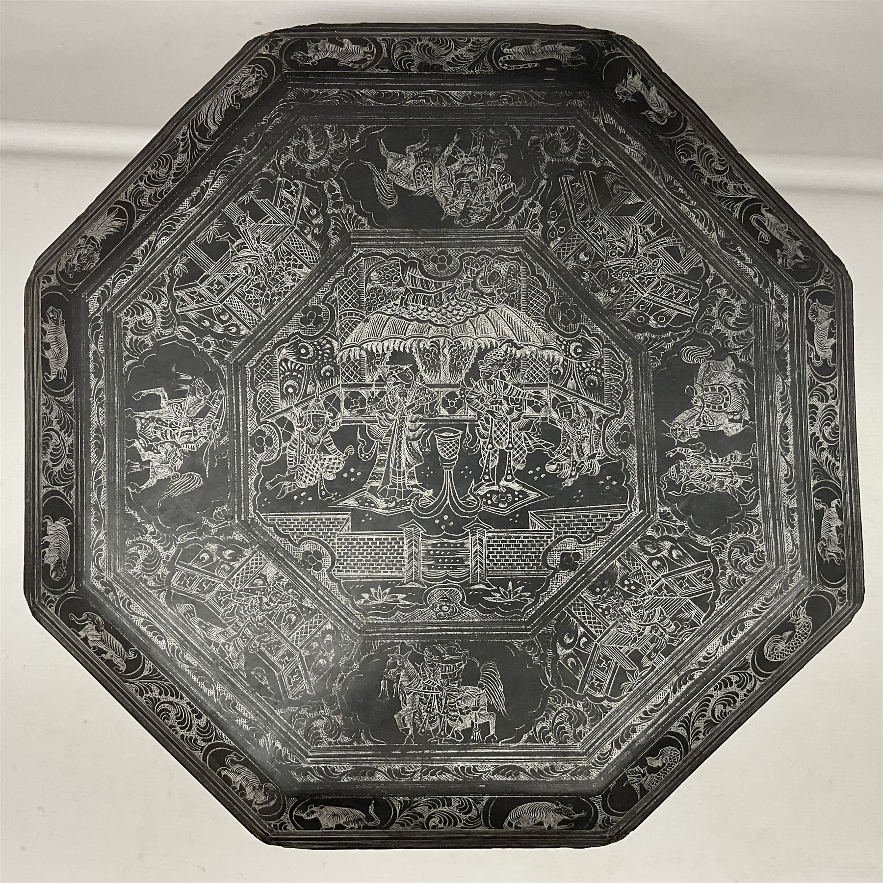 Anglo-Indian octagonal occasional table, with silvered inlay and a central panel depicting a temple scene, H36cm 