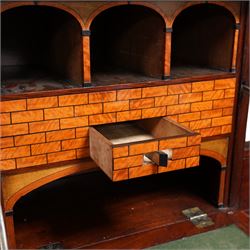 19th century Biedermeier figured mahogany cylinder bureau cabinet, the raised super structure with stepped pointed pediment over hidden cupboard and hinged fall front, the interior fitted with pigeonholes and secret drawers behind rusticated inlay, curved flanking cupboards fitted with internal drawers, the cylinder top opens to reveal small drawers, document divisions and secret compartments, sliding desk with central hinged writing surface, inlaid with satinwood bands and draped festoons, fitted with three long drawers, on bracket feet