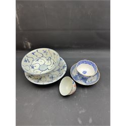 Early 19th century Chinese Tek Sing bowl, decorated with stylised blossoms, with 'Nagel Auctions' label to base, H6.5cm D15.5cm, together with a  Tek Sing similar saucer, D18cm, a Chinese tea bowl decorated in blue and red blossoming flowers, a Chinese blue and white saucer, and an English blue and white Willow pattern tea bowl, (5)