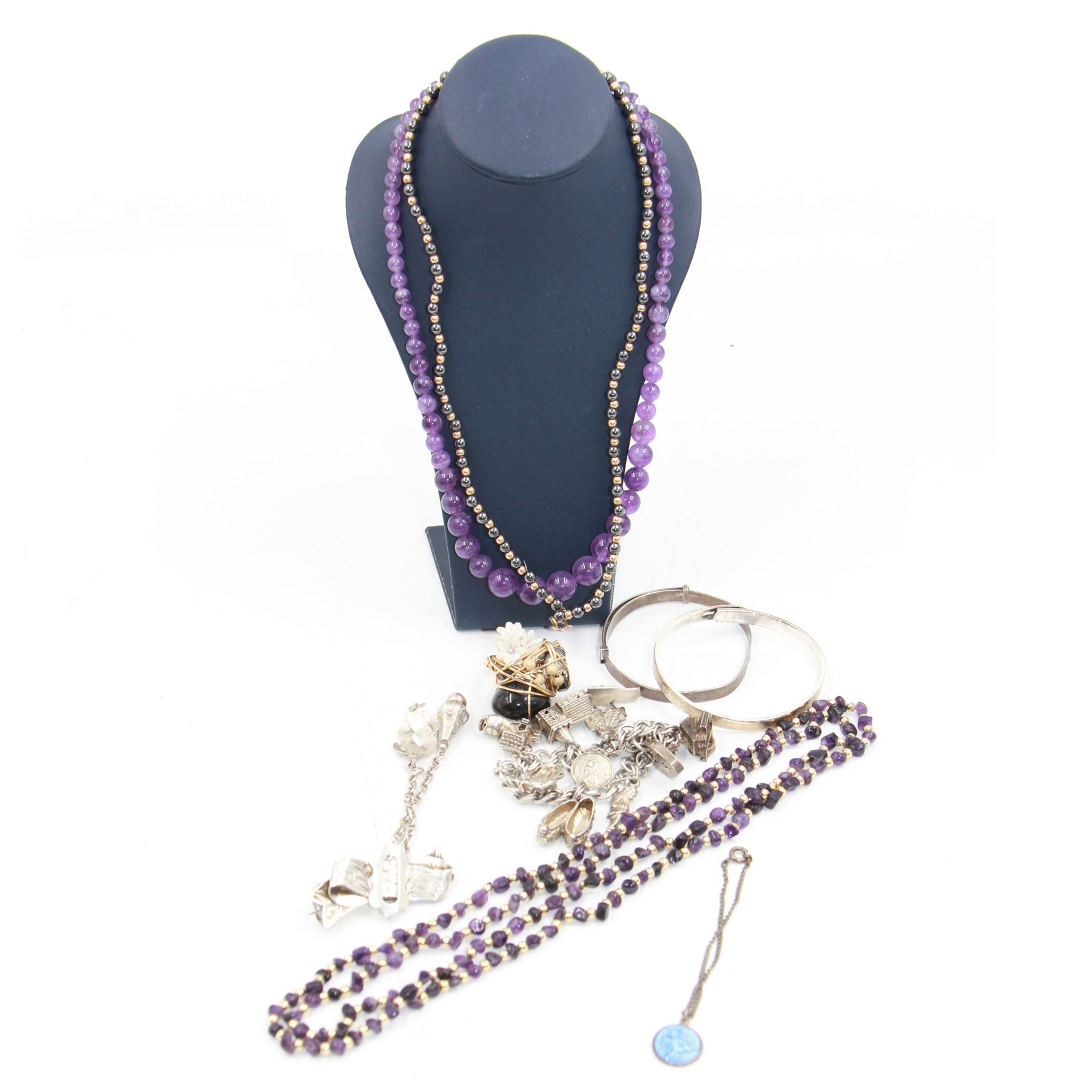 Amethyst bead necklace, with 9ct gold barrel clasp, together with a heamatite necklace with 9ct gold clasp, one other beaded necklace, silver charm bracelet, two silver bangles, silver buckle brooch and a 14ct gold filled wirework ring