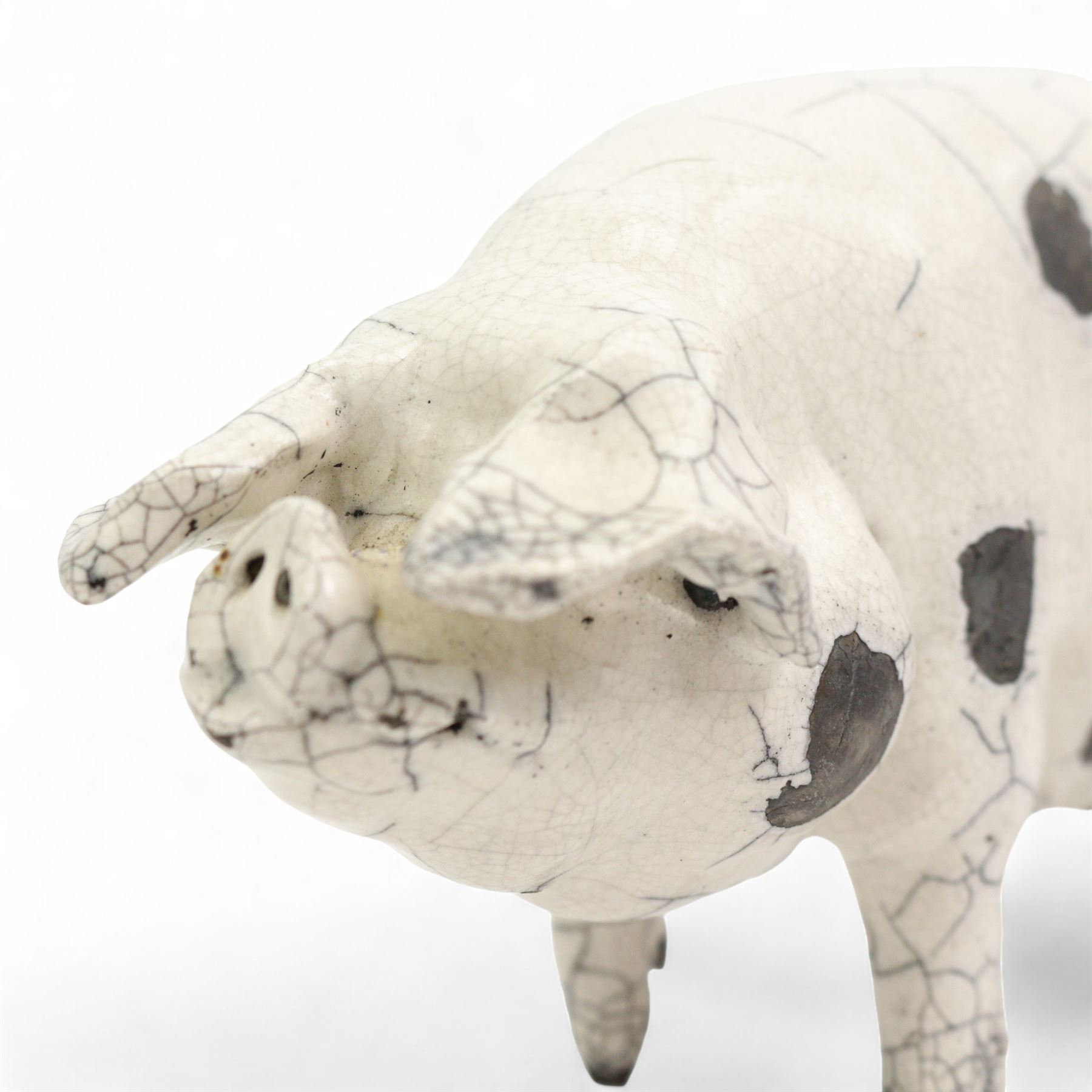 Raku fired model of a pig, in the style of Lawson C Rudge, unsigned, L24cm 