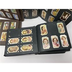 Four albums of cigarette cards, including Will's and Player's examples