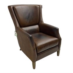 Club reading armchair, upholstered in brown Brazilian leather, studded detail, oak tapering legs