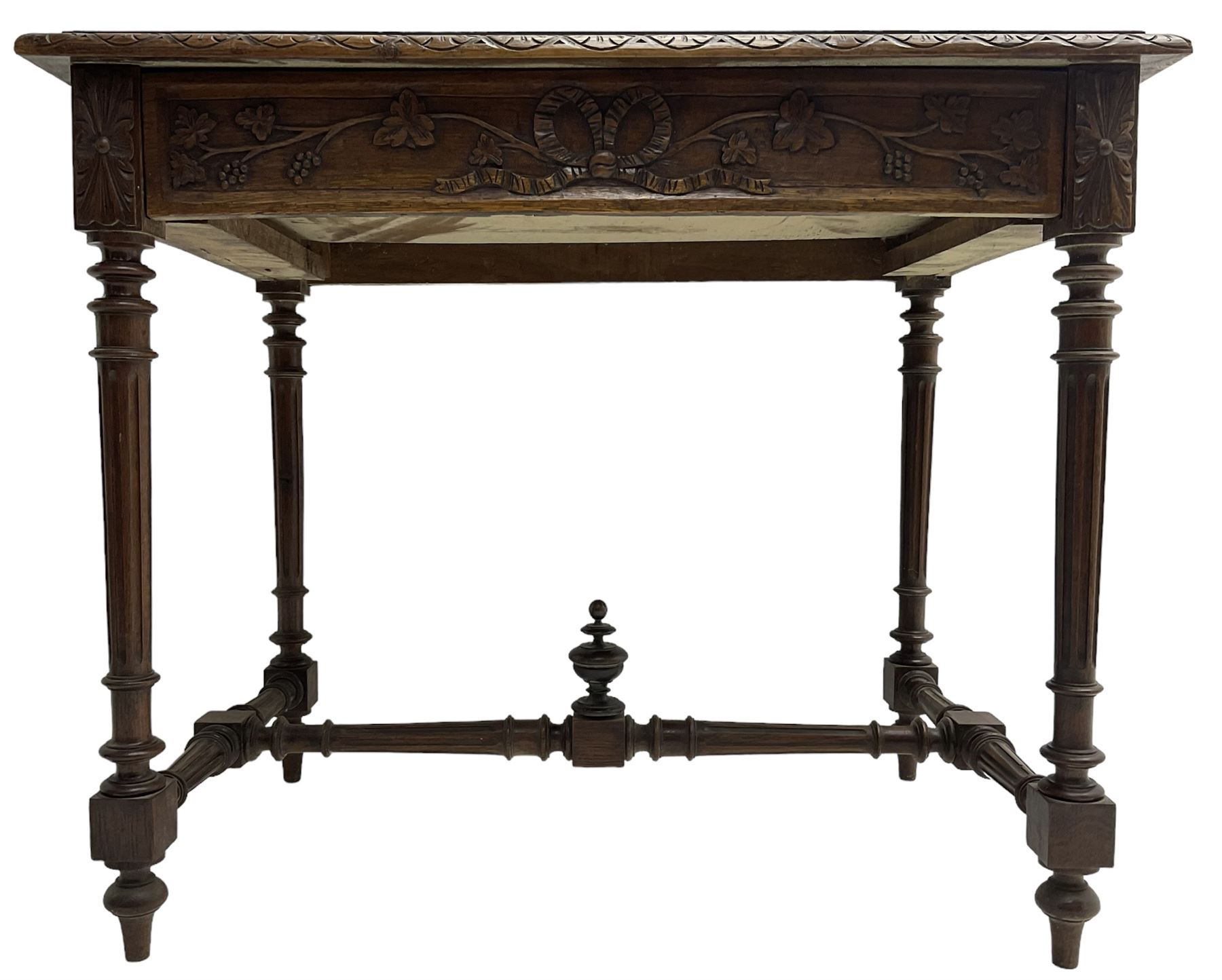 19th century walnut side table,  rectangular top with lunette carved moulded edge, the frieze drawer carved with ribbon and extending vine branch and grapes, on turned and fluted supports united by fluted stretcher with centre finial 