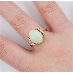 18ct gold single stone opal ring, with four round brilliant cut diamonds set either side, old opal ring, with four diamonds set either side