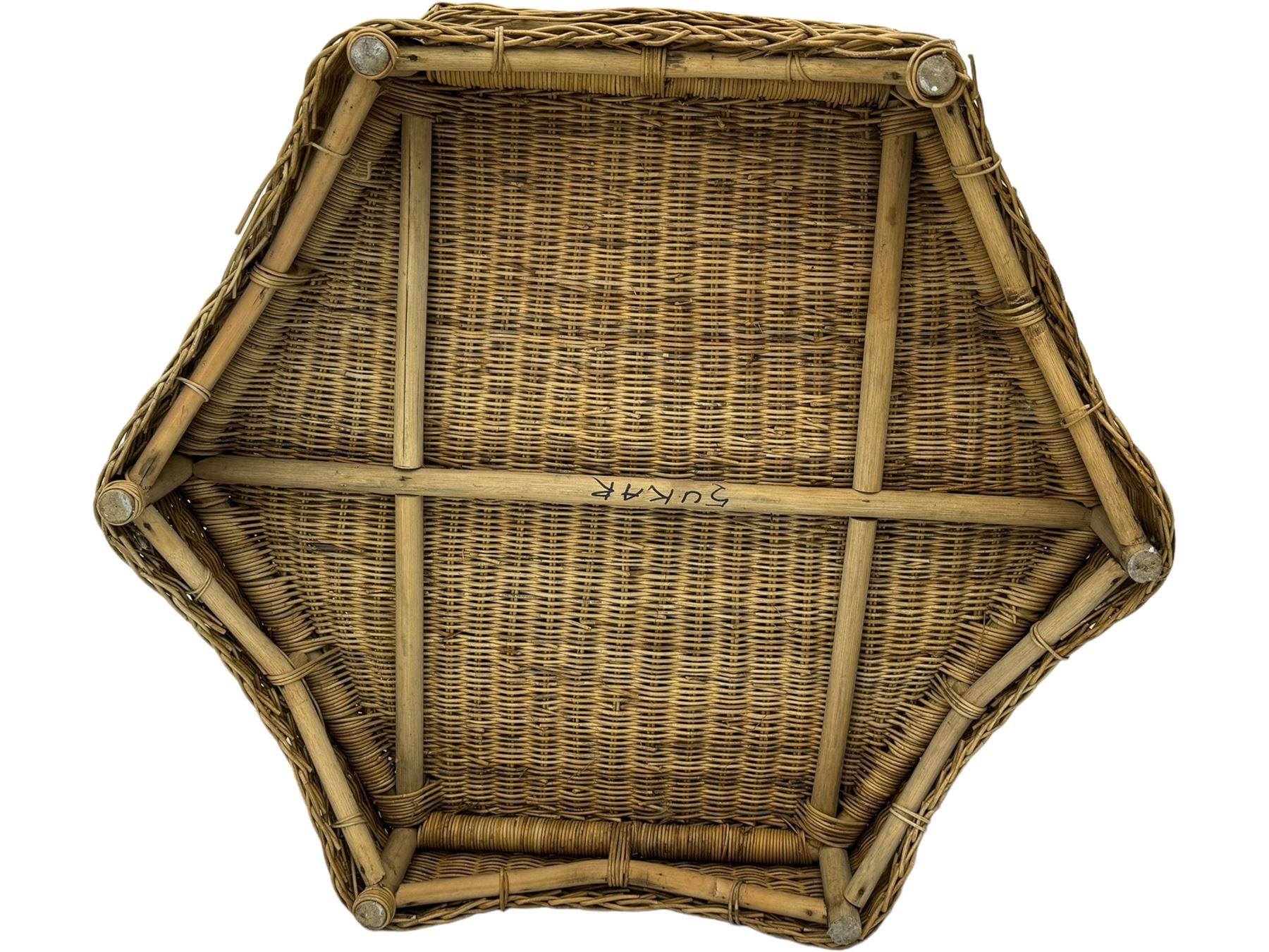 Mid-20th century hexagonal wicker coffee table, featuring woven top with pattern that radiates from the centre, lower shelf for additional storage, supported by interwoven wicker legs